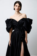 Black volumetric gown by Monetre featuring a sculpted, elegant silhouette perfect for formal events.