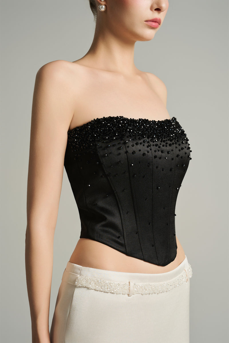 Black strapless corset top with crystal embellishments by I.H.F Studio, featuring a fitted design and smooth fabric.