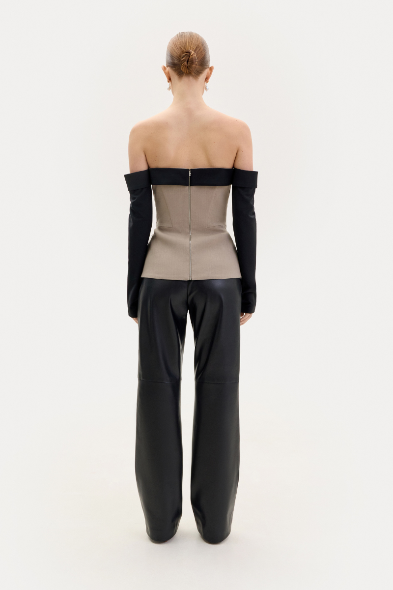 Black faux leather straight-leg pants from ELENAREVA, showing a sleek fit and smooth texture on a white background.