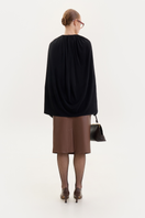 Black jersey cape bodysuit by ELENAREVA, featuring a sleek, fitted design with cape-style shoulders and long sleeves.