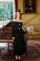 Black Nana Jacqueline Blaire maxi skirt with flowing fabric and high waist, styled for a chic, elegant look.