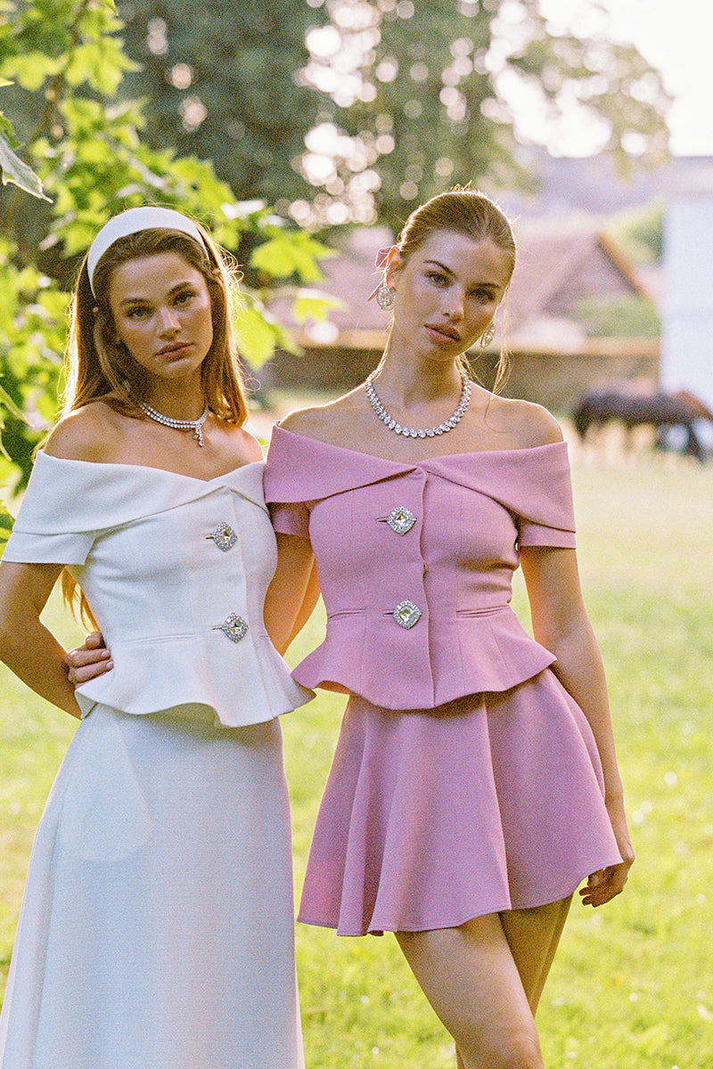 Nana Jacqueline BLAKELY pink top, showcasing a stylish, fitted blouse with a high neckline and elegant design.