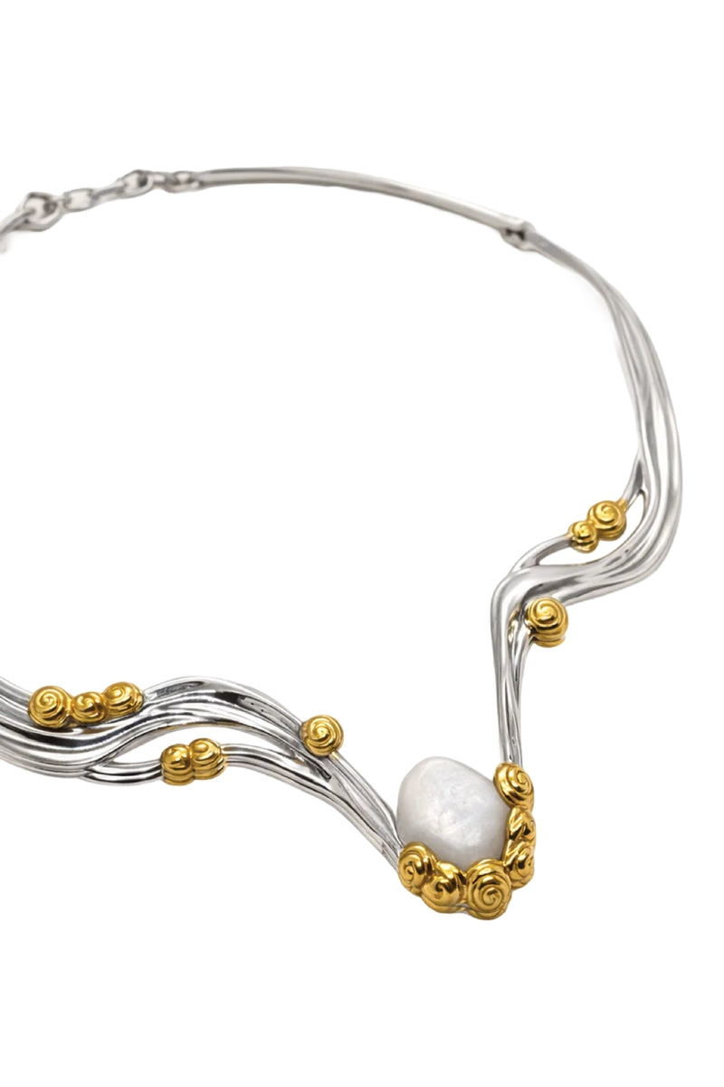 Jude Benhalim Bloom Necklace featuring a delicate floral-inspired design on a silver chain, close-up view.