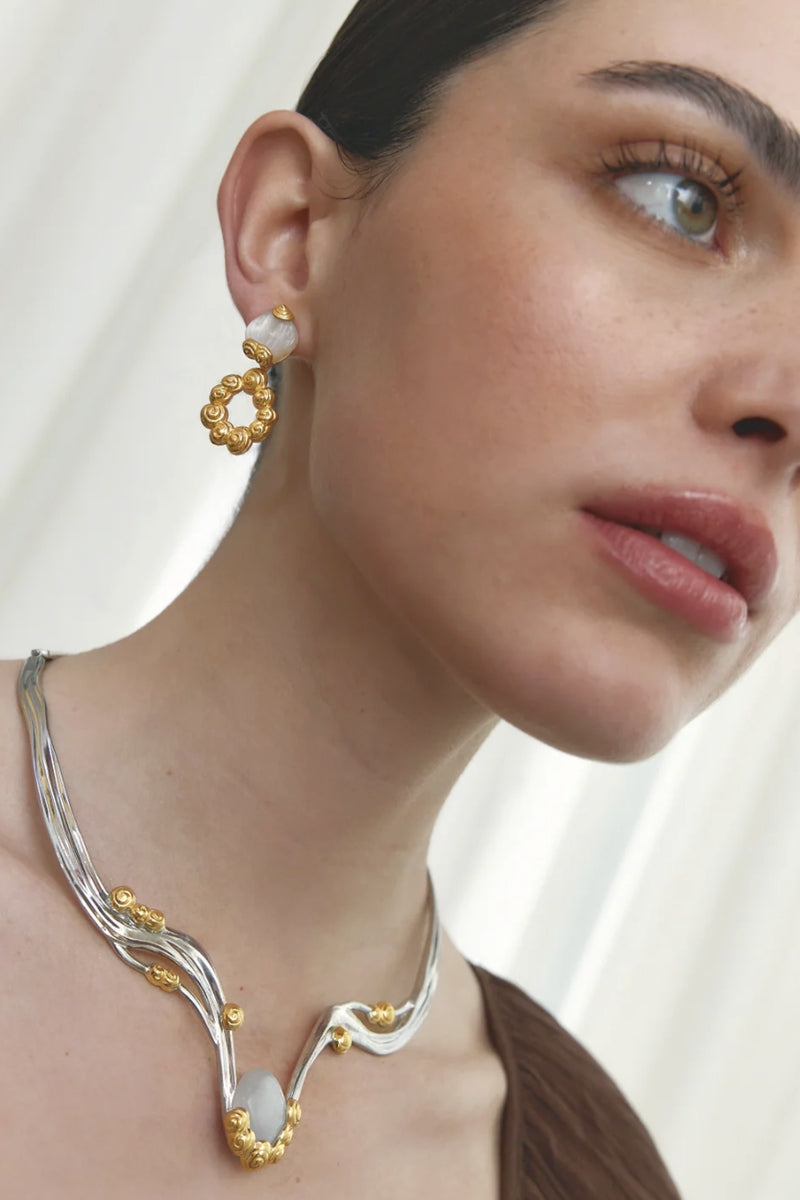 Jude Benhalim Bloom Necklace featuring a delicate floral pendant on a sleek chain, perfect for elegant jewelry styling.