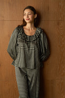 Black Blooming Women's Pajama Set by MANITO featuring a comfortable, stylish sleepwear design with floral accents.