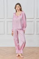Pink blooming women's pajama set by MANITO, soft fabric with floral print, includes a top and matching pants for comfortable sleepwear.