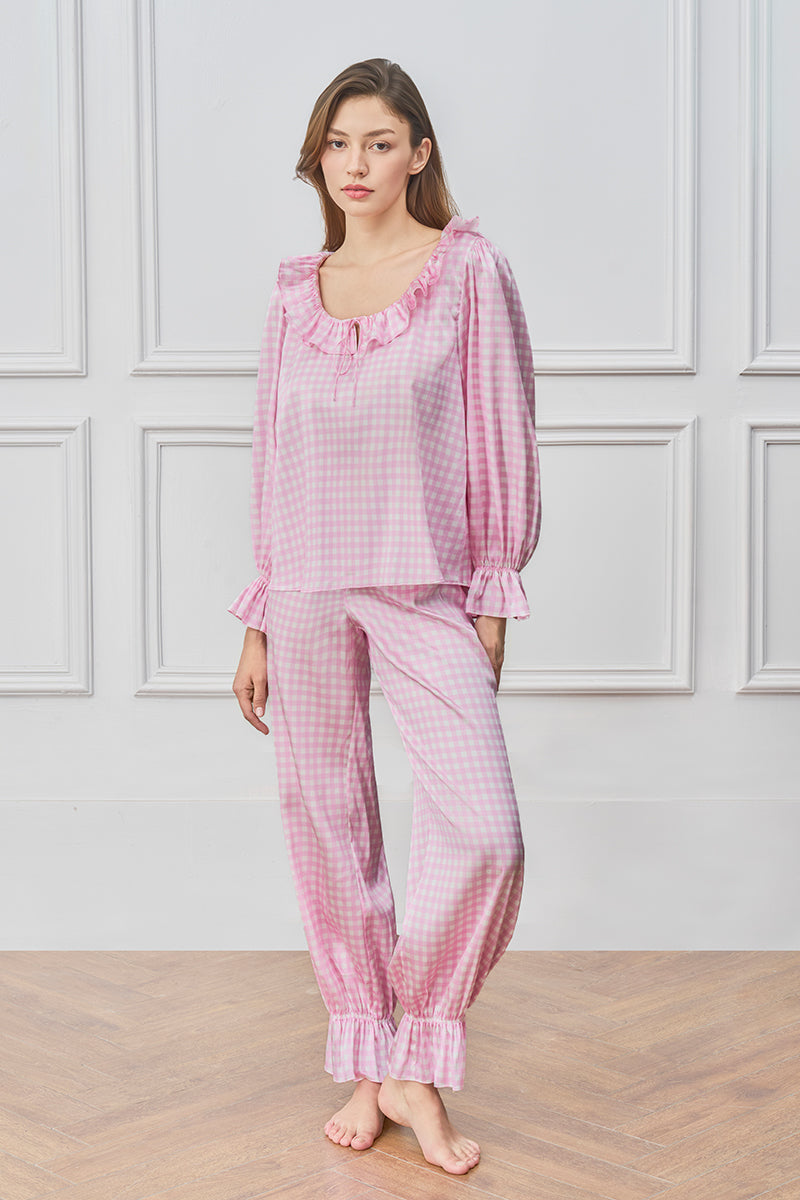 Pink blooming women's pajama set by MANITO, soft fabric with floral print, includes a top and matching pants for comfortable sleepwear.