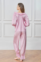 Pink blooming women's pajama set by MANITO, featuring a comfortable, floral-patterned sleepwear ensemble.