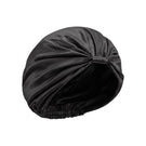 Black silk sleep cap for women by MANITO, featuring a blooming floral design, designed for comfortable nighttime wear.