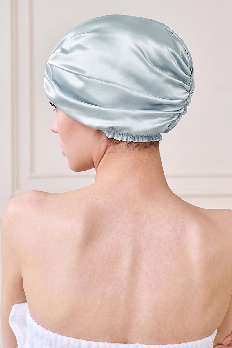 Blue silk sleep cap for women by MANITO, soft and comfortable hat designed for restful nights and hair protection.