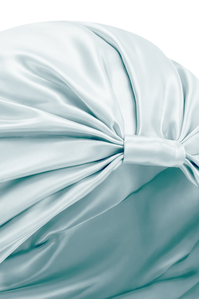 Blue silk sleep cap for women by MANITO, a soft, comfortable hat designed for restful sleep and gentle hair protection.