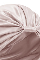Pink silk sleep cap for women by MANITO, featuring a blooming floral design, soft and comfortable for restful sleep.