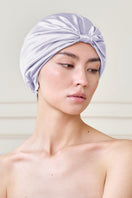 Purple silk sleep cap for women by MANITO, featuring a blooming floral design, designed for comfortable nighttime wear.