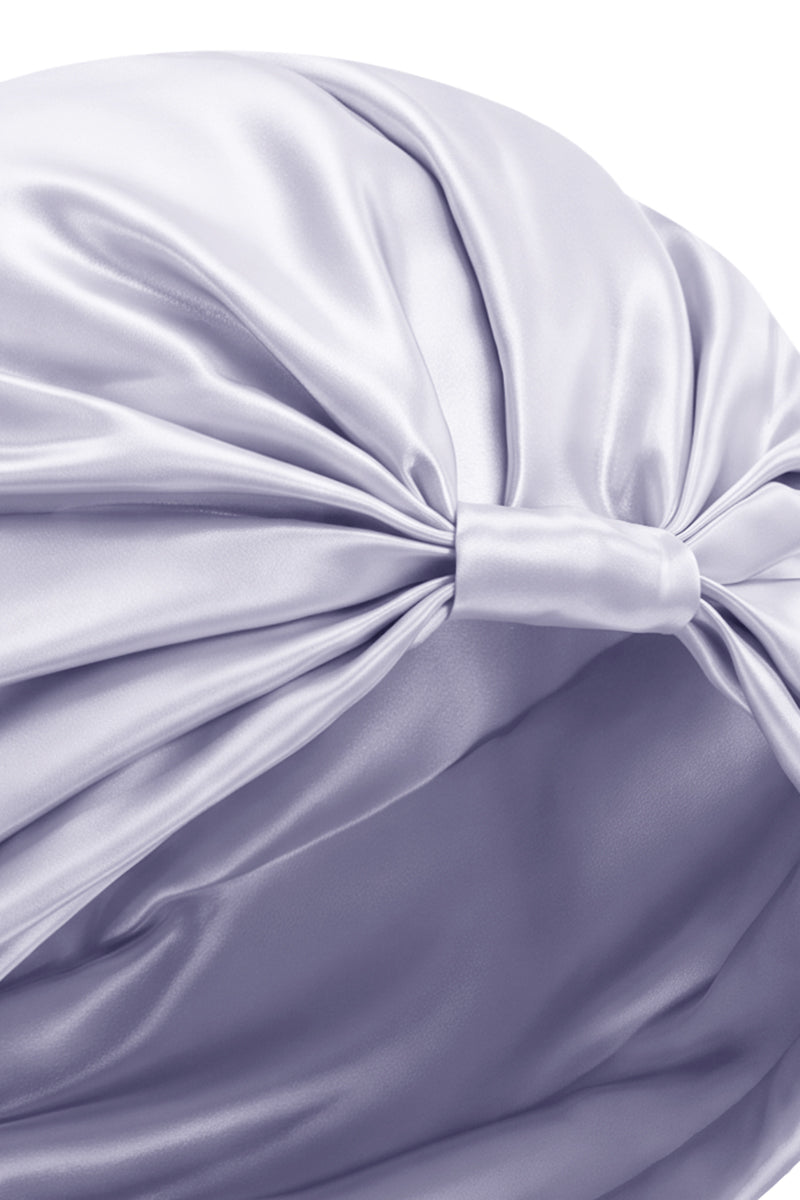 Purple silk sleep cap for women by MANITO, stylish and comfortable hat designed for gentle hair care and nighttime wear.