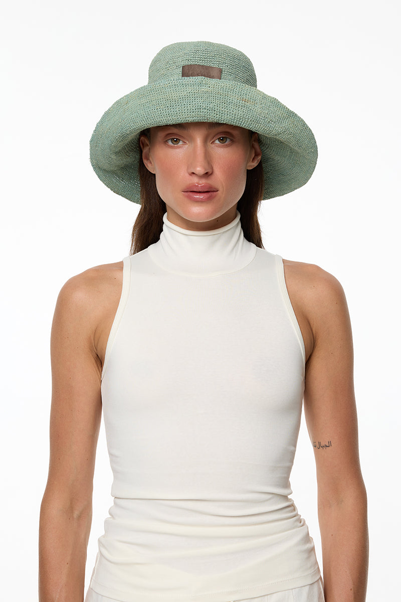 Blue bucket hat by LE SH KA, featuring a stylish wide brim and casual design, perfect for sun protection and everyday wear.