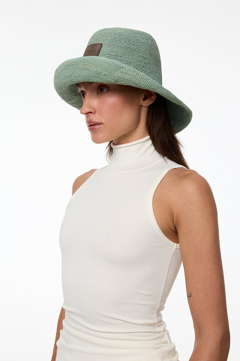 Blue bucket hat by LE SH KA featuring a casual brim and vibrant blue color, perfect for sun protection and stylish accessories.