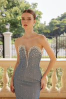 Elegant blue Margaux glitter elastic gown by 21Six, featuring a flowing design and shimmering embellishments.