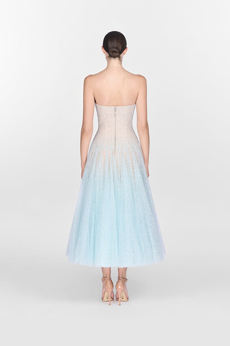 Blue draped lace gown by Montsand, showcasing a flowing midi dress with elegant lace details and a sophisticated silhouette.