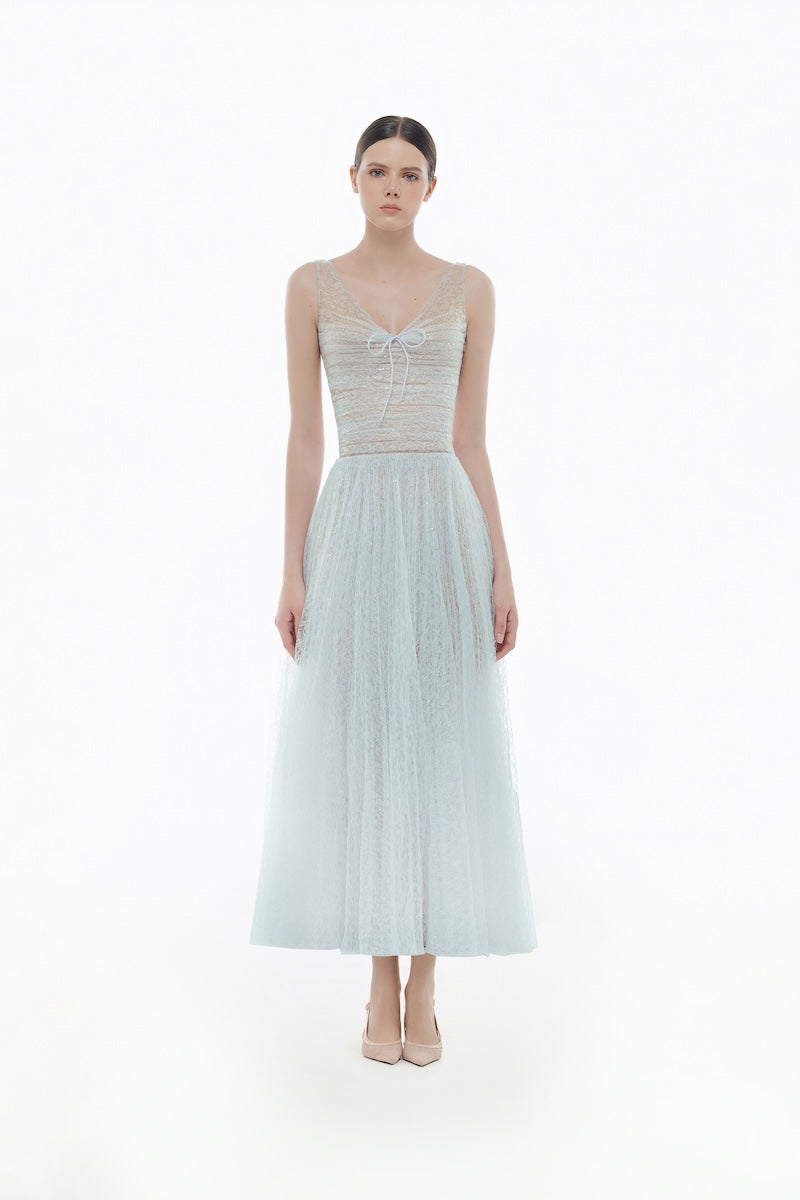 Blue V-neck draped gown by Montsand, elegant midi dress with flowing fabric and sophisticated design.