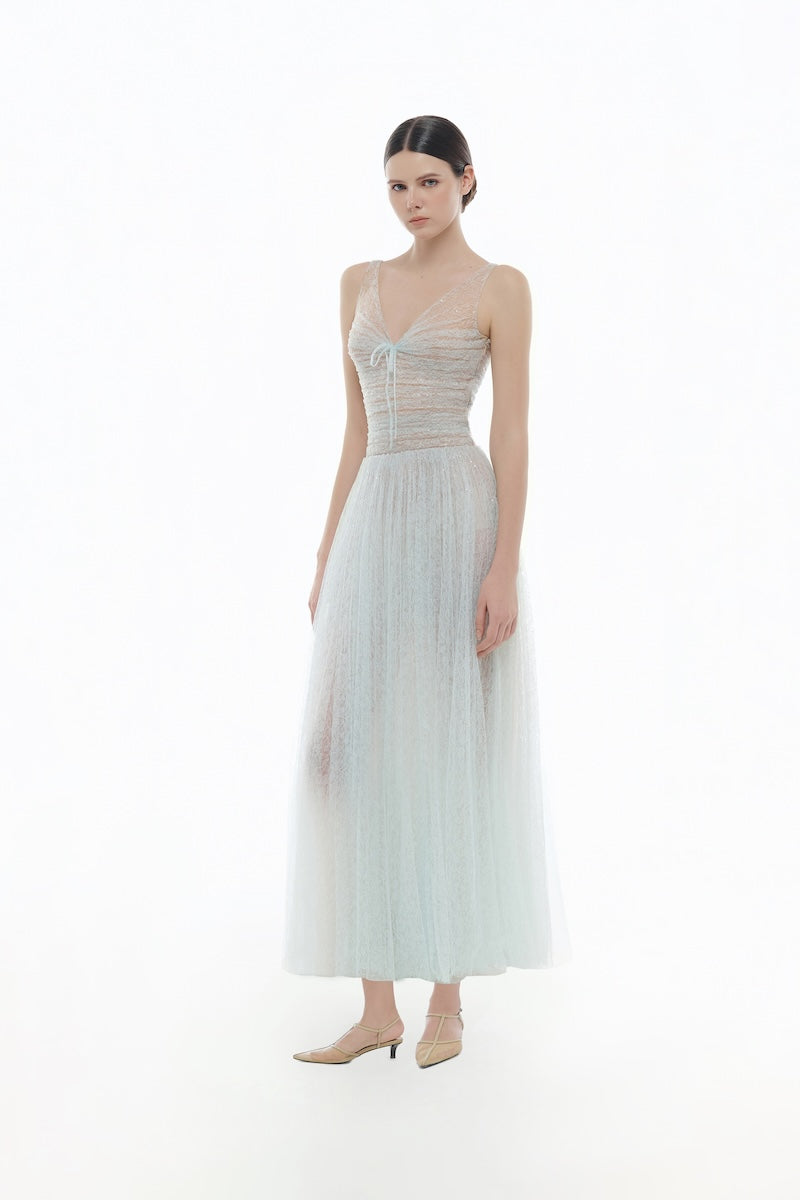 Blue V-neck draped midi dress by Montsand, featuring a flowing silhouette and elegant draping fabric.