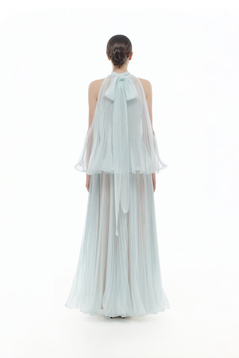 Elegant blue pleated gown by Montsand, midi-length dress with flowing fabric and pleated details, perfect for formal occasions.