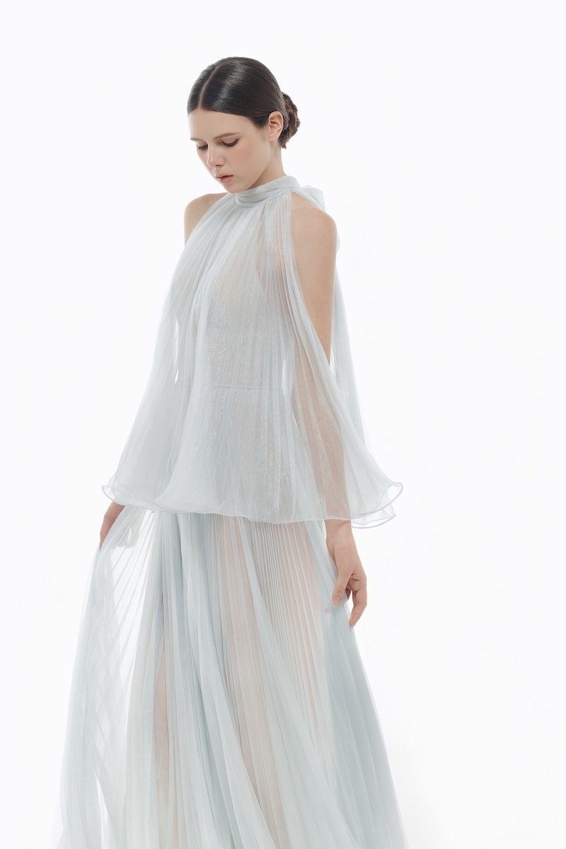 Blue pleated gown by Montsand featuring a flowing midi length and elegant design, perfect for formal occasions.