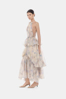 Blue tiered halter bubble maxi dress by Montsand, featuring a flowing design with layered fabric and halter neckline.