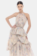 Blue tiered halter bubble maxi dress by Montsand, featuring a flowing silhouette and vibrant blue color with tiered design.