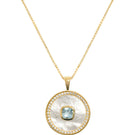 Blue topaz birthstone necklace with mother-of-pearl accents, vermeil gold setting, by Freya Rose.