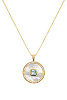Blue topaz birthstone necklace with mother-of-pearl accents, vermeil gold setting, by Freya Rose.