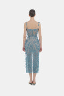 Elegant blue beaded lace pencil gown by Montsand, featuring intricate lace details and a fitted silhouette.