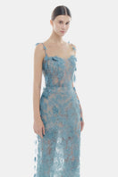 Blue beaded lace pencil gown by Montsand featuring intricate lace details and a sleek, fitted silhouette.