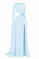 Blue embellished cape gown by Monika Dimova with intricate beadwork and flowing fabric, perfect for elegant occasions.