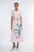 Blush sculpted notched A-line midi dress by Tiny Ink, featuring a fitted bodice and flowing skirt, shown from the side view.