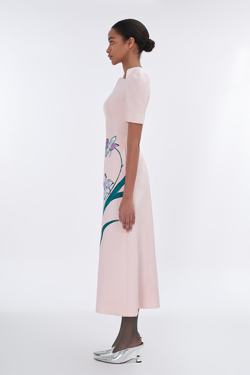 Blush sculpted notched A-line midi dress by Tiny Ink featuring a fitted bodice and flared skirt, displayed on a model.