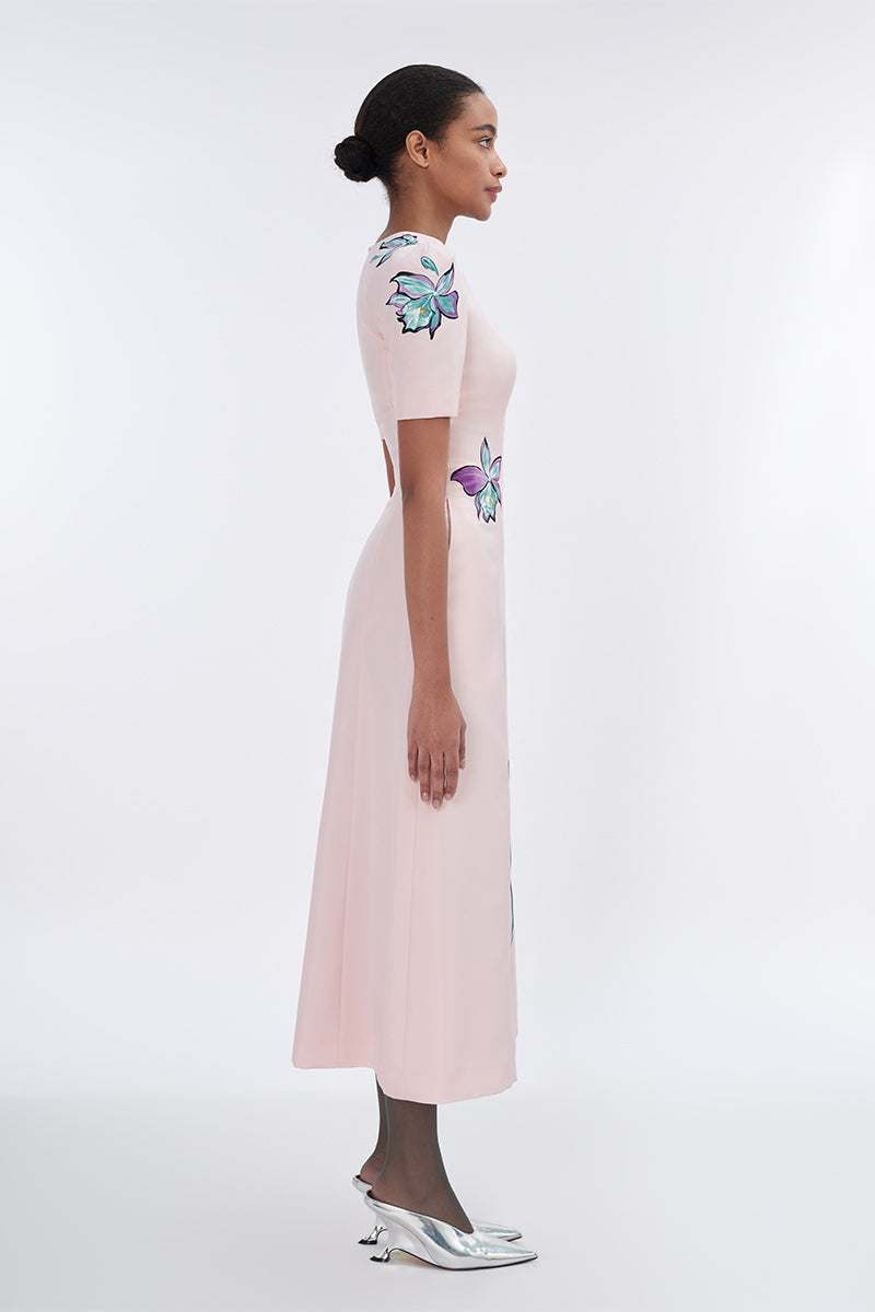 Blush sculpted notched A-line midi dress by Tiny Ink, featuring a fitted bodice and flowing skirt, styled for elegant occasions.