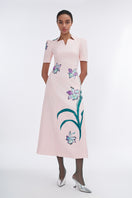 Blush sculpted notched A-line midi dress by Tiny Ink, featuring a fitted waist and stylish silhouette, shown on a model.
