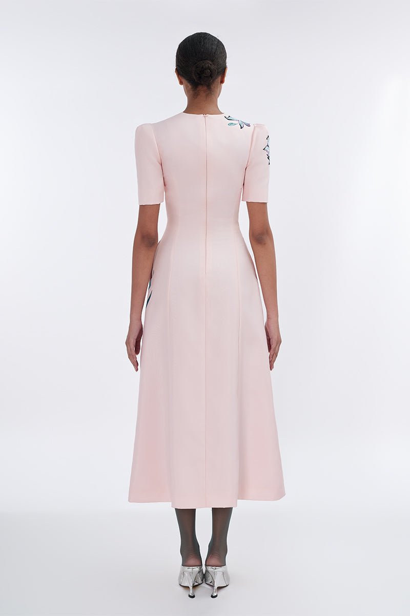Blush sculpted notched A-line midi dress by Tiny Ink, featuring a fitted bodice and flared skirt with notch details.
