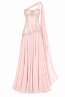 Blush embellished cape gown by Monika Dimova featuring a fitted corset and flowing evening design.
