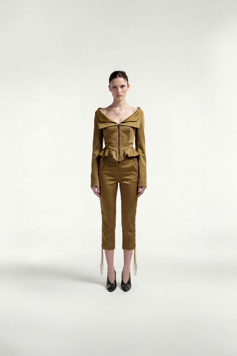 Green boat-neck boned jacket by Tayfun Kaba featuring structured design and tailored fit, shown on a mannequin.
