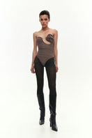 Brown draped bustier bodysuit with flower applique by Kris Marán, featuring a fitted design and elegant detailing.