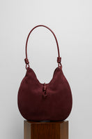 Maroon suede boho shoulder bag from Folklore The Label with a relaxed, stylish design and adjustable strap.