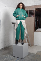 Maz Manuela Álvarez Milano green leather bomber jacket showcasing a stylish, fitted design with a smooth leather finish.