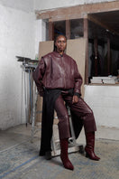 Wine red leather bomber jacket by MAZ Manuela Álvarez, stylish and fitted with front pockets and ribbed cuffs.