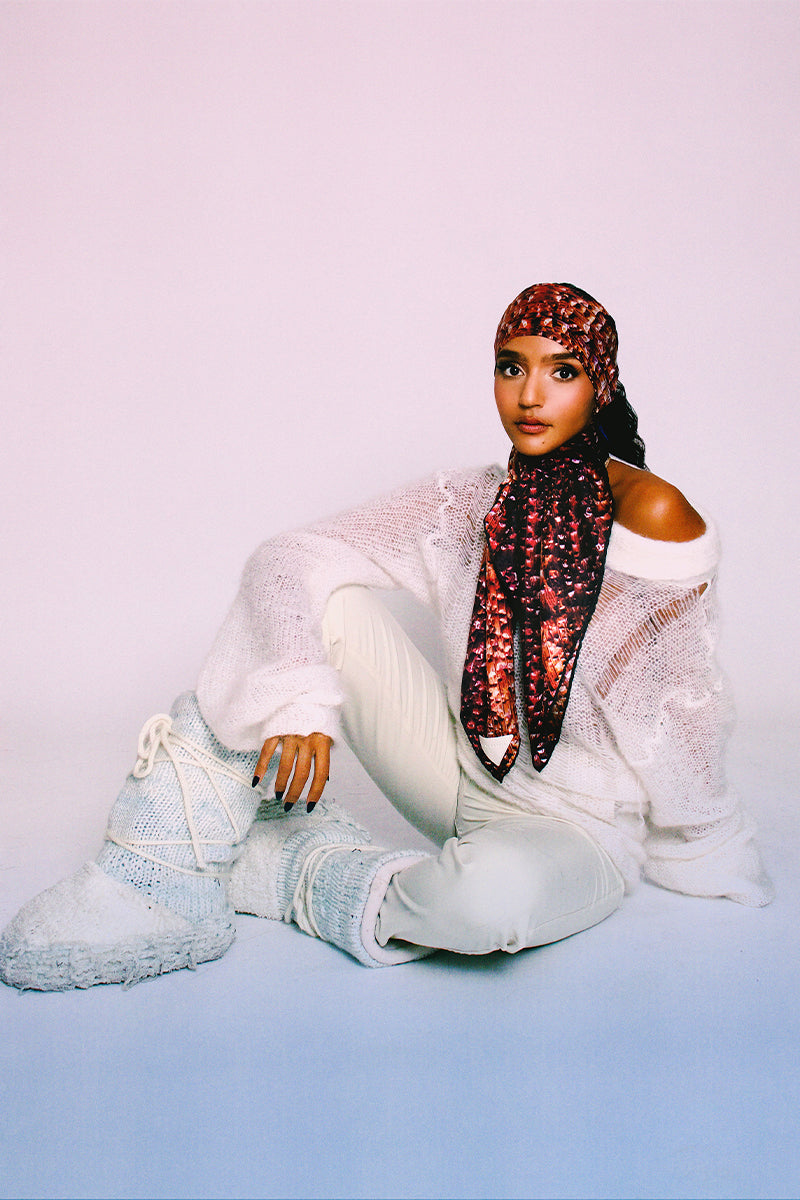 Bordeaux silk scarf by Amel Batita featuring a stylish pattern, draped to showcase its elegant design and luxurious fabric.