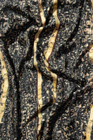 Brocot silk scarf in brown with detailed border, styled as a luxurious stole by Amel Batita, perfect for elegant accessories.