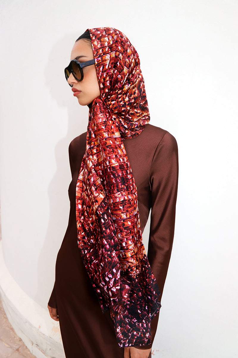 Bordeaux Brocot silk scarf by Amel Batita featuring intricate woven patterns, styled as a headscarf or fashion accessory.