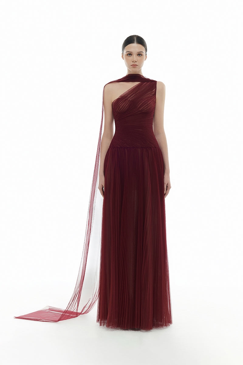Elegant Bordeaux draped gown by Montsand featuring flowing fabric and sophisticated design, perfect for formal occasions.