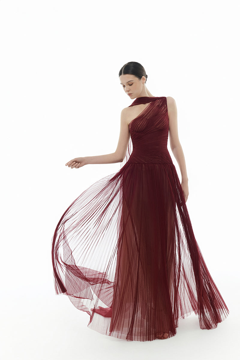 Elegant Bordeaux draped gown by Montsand featuring flowing fabric and a sophisticated maxi silhouette.