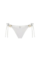 Nelblu Luna bikini bottom in Filigrana pattern, with floral design and adjustable side ties, lying flat on a white background.
